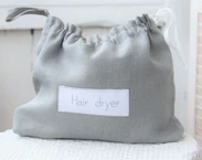 Grey Linen hair dryer bag for beach house, Airbnb blow dryer holder, hotel bathroom hairdryer organizer, hair accessories storage